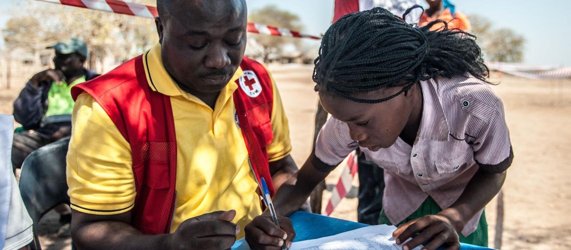 Humanitarian workers perusing paper documents