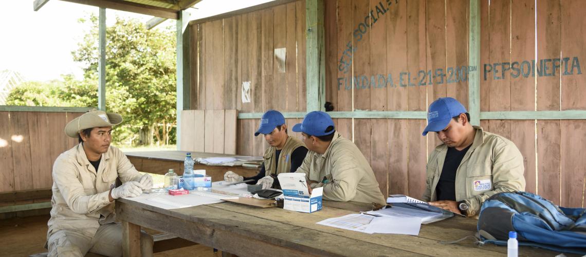 Men working together around a table