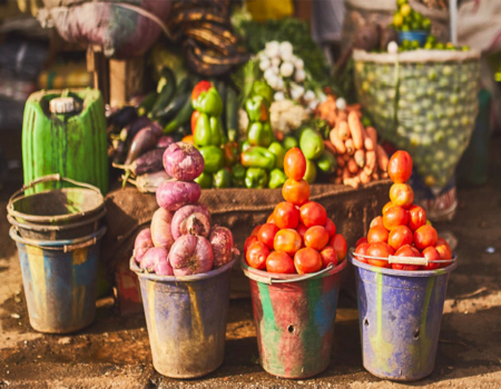 Food piled high in tin buckets