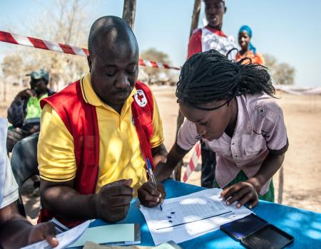 Humanitarian workers perusing paper documents