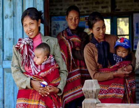 A group of women carrying babies